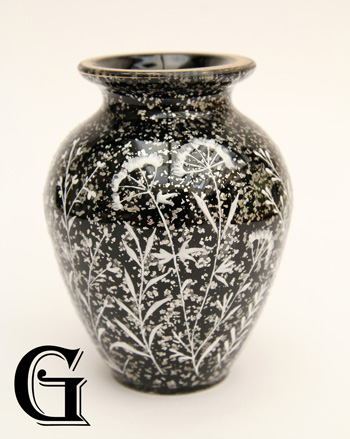 black glass vase with enamel flowers